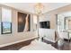 Bright living room featuring stylish decor, dark wood floors and waterfront views at 14 Lockwood Dr # 4C, Charleston, SC 29401