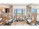 Living room showcasing stylish seating arrangements and a bright airy feel with views to the outside at 14 Lockwood Dr # 4C, Charleston, SC 29401