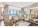 Open-concept living area featuring ample seating, an accent mirror, and bright natural light at 14 Lockwood Dr # 4C, Charleston, SC 29401