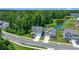 Aerial view showcasing a neighborhood with pond access, mature trees, and well-maintained landscaping at 141 Cherry Grove Dr, Summerville, SC 29483