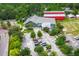 An aerial view of the YMCA complex, with its green building, red barn, sports field, and parking lot at 141 Cherry Grove Dr, Summerville, SC 29483