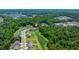 An aerial view of a well-planned community nestled amidst lush green forests, offering a serene and picturesque living environment at 141 Cherry Grove Dr, Summerville, SC 29483