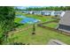Beautifully fenced backyard with lush green grass and serene pond views, creating a perfect outdoor retreat at 141 Cherry Grove Dr, Summerville, SC 29483