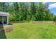 Spacious backyard with a privacy fence and verdant lawn, perfect for outdoor entertaining and relaxation at 141 Cherry Grove Dr, Summerville, SC 29483