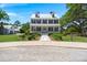 Stately two-story home boasting classic architectural design, a welcoming front porch, and meticulously manicured landscaping at 141 Cherry Grove Dr, Summerville, SC 29483