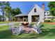 Community fire pit area with Adirondack chairs, perfect for relaxing and socializing in a serene outdoor setting at 141 Cherry Grove Dr, Summerville, SC 29483