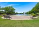 Scenic outdoor stage area with benches overlooking a serene lake with a fountain at 141 Cherry Grove Dr, Summerville, SC 29483