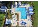 Aerial view of a community pool with cabanas and lounge chairs, creating a resort-style atmosphere at 141 Cherry Grove Dr, Summerville, SC 29483