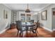 Inviting dining room with a round table, stylish chairs, and natural light from french doors at 1521 Wren Ave, Mount Pleasant, SC 29464