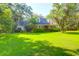 Charming brick home with lush green lawn and mature trees creating a peaceful curb appeal at 1521 Wren Ave, Mount Pleasant, SC 29464