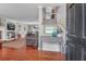 Warm foyer with hardwood floors, leading to a staircase and a living room with a fireplace at 1521 Wren Ave, Mount Pleasant, SC 29464