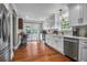 Bright kitchen with stainless steel appliances, white cabinets, and double doors leading to a pool at 1521 Wren Ave, Mount Pleasant, SC 29464