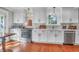 Bright kitchen with stainless steel appliances, white cabinetry, and hardwood floors at 1521 Wren Ave, Mount Pleasant, SC 29464