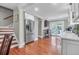 Modern kitchen with stainless steel appliances, hardwood floors, and white cabinets at 1521 Wren Ave, Mount Pleasant, SC 29464