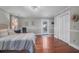 Spacious bedroom with wood floors, closet, and natural light entering from backyard patio access at 1521 Wren Ave, Mount Pleasant, SC 29464