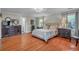 Bedroom featuring hardwood floors, neutral wall color, and two side tables at 1521 Wren Ave, Mount Pleasant, SC 29464