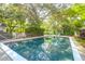 Backyard pool with outdoor dining offers the perfect setting for relaxing and entertaining at 1521 Wren Ave, Mount Pleasant, SC 29464
