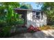 A charming shed with flower boxes, a wooden door, and an open side provides storage and adds character at 1521 Wren Ave, Mount Pleasant, SC 29464