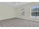 Bright bedroom with a ceiling fan, carpet and large windows offering plenty of natural light at 1631 Camfield Ln, Mount Pleasant, SC 29466