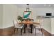 Well-lit dining room featuring modern lighting, hard wood floors, neutral walls, and modern art at 1631 Camfield Ln, Mount Pleasant, SC 29466