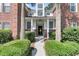 Home exterior featuring partial brick siding and bushes in front, near the porch entrance at 1631 Camfield Ln, Mount Pleasant, SC 29466