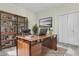Home office with a large wooden desk, black leather chair, and ample storage space at 1631 Camfield Ln, Mount Pleasant, SC 29466