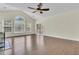Living room with hardwood floors, a ceiling fan, and sliding glass doors leading to the outdoor space at 1631 Camfield Ln, Mount Pleasant, SC 29466