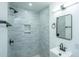 Updated bathroom features a stylish shower with gray tiling, a niche, and modern fixtures at 1655 Pinckney Park Dr, Charleston, SC 29407