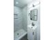 Modern bathroom with a stylish shower, sleek vanity, mirror, and contemporary fixtures at 1655 Pinckney Park Dr, Charleston, SC 29407