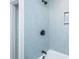 Light blue tiled shower with a niche, and a shower/tub combo at 1655 Pinckney Park Dr, Charleston, SC 29407