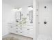 Bathroom with double sinks, white cabinets, and frameless shower with overhead fixture at 1655 Pinckney Park Dr, Charleston, SC 29407