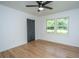 Bright bedroom featuring hardwood floors, a ceiling fan, and a double-window allowing ample natural light at 1655 Pinckney Park Dr, Charleston, SC 29407