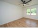 Sun-filled room with hardwood floors, ceiling fan, and two windows offerring natural light at 1655 Pinckney Park Dr, Charleston, SC 29407