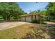 Charming brick home featuring a two-car garage and a tree-shaded lot at 1655 Pinckney Park Dr, Charleston, SC 29407