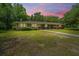 Charming brick home with mature trees, lush landscaping and a spacious yard at 1655 Pinckney Park Dr, Charleston, SC 29407
