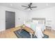 Cozy main bedroom featuring wood floors, neutral decor and a ceiling fan at 1655 Pinckney Park Dr, Charleston, SC 29407