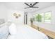 Bright main bedroom with natural light, light colored walls and beautiful hardwood floors at 1655 Pinckney Park Dr, Charleston, SC 29407