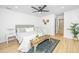 Comfortable main bedroom featuring a ceiling fan, stylish decor and wood floors at 1655 Pinckney Park Dr, Charleston, SC 29407