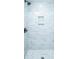 Updated shower with gray tiling, a niche, and modern fixtures at 1655 Pinckney Park Dr, Charleston, SC 29407