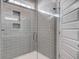 Modern glass enclosed shower with gray subway tile and a built in shower niche at 1671 Grange Cir, Summerville, SC 29486