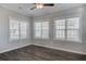 Bright bedroom featuring durable wood-look floors and neutral paint with large windows at 1671 Grange Cir, Summerville, SC 29486