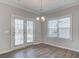 Bright dining area with backyard access and views of the outdoor landscaping at 1671 Grange Cir, Summerville, SC 29486