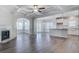 Spacious living room with a coffered ceiling, fireplace, and views into the dining and kitchen areas at 1671 Grange Cir, Summerville, SC 29486