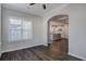 Open-concept living space featuring wood-look floors, and views into the kitchen at 1671 Grange Cir, Summerville, SC 29486