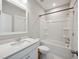 Bathroom with a white vanity, quartz countertop, a framed mirror and tub with shower at 1671 Indy Dr, North Charleston, SC 29405
