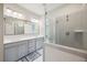 Bathroom featuring a glass enclosed shower with gray subway tile and dual sink vanity at 1671 Indy Dr, North Charleston, SC 29405