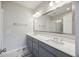 Bathroom featuring a large framed mirror above the dual sink vanity and tile flooring at 1671 Indy Dr, North Charleston, SC 29405