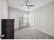 Bedroom featuring carpet, ceiling fan, natural light and view of the ensuite bathroom at 1671 Indy Dr, North Charleston, SC 29405