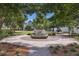 Scenic community space with a circular bench, lush landscaping, and neighborhood views at 1671 Indy Dr, North Charleston, SC 29405