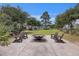 Cozy community fire pit area with Adirondack chairs, perfect for gatherings at 1671 Indy Dr, North Charleston, SC 29405